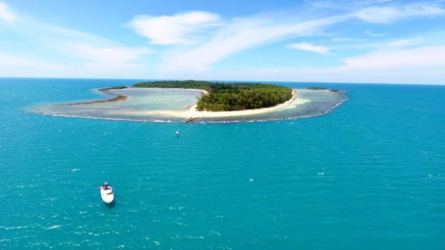 image showing our luxury motor yacht near a deserted island in the gulf of thailand