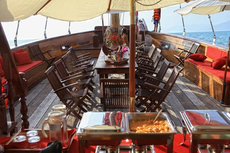table set for a luxury dining experience on the red baron samui sailing yacht