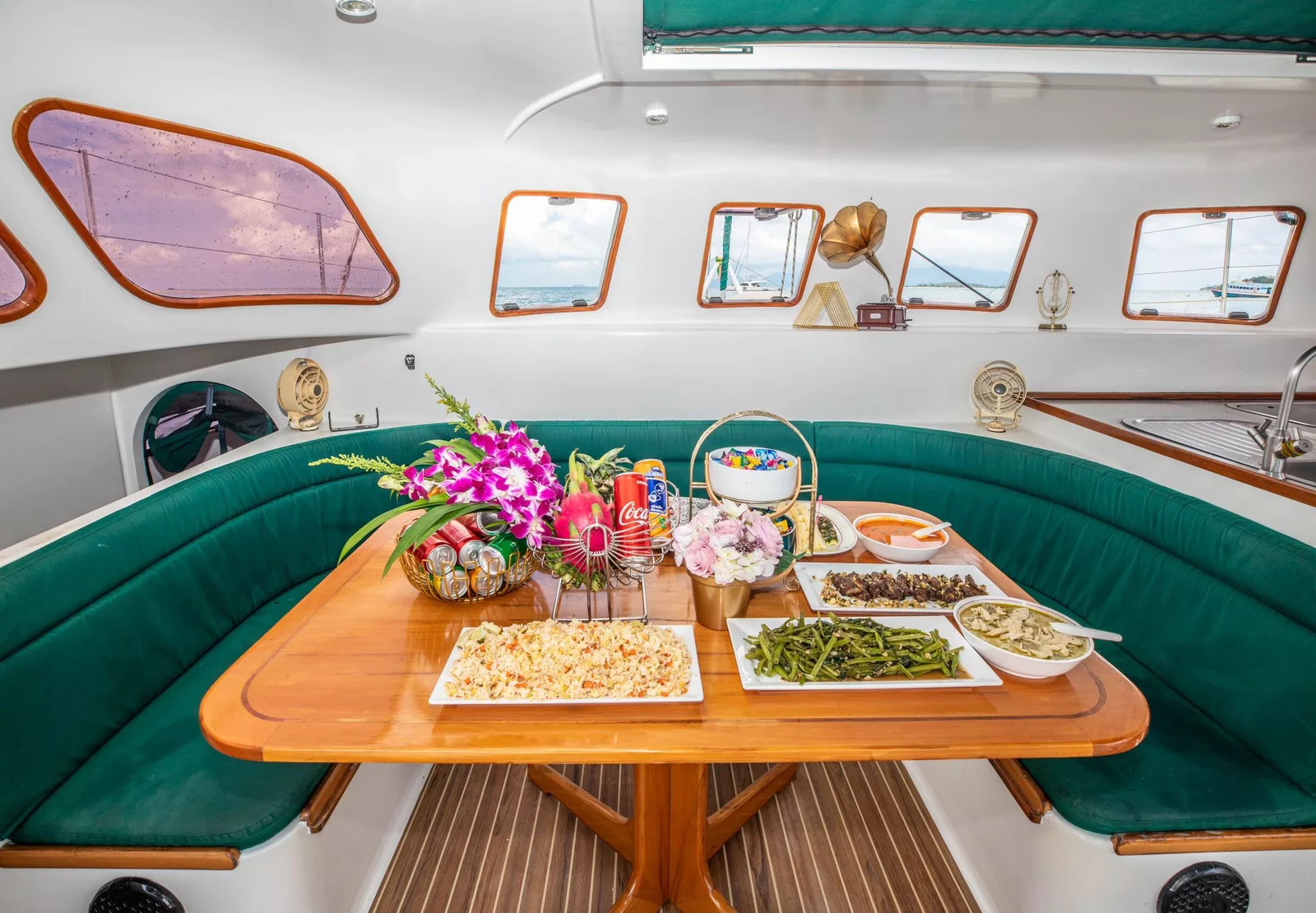 image showing dining table with thai buffet lunch on a family friendly slider catamaran charter koh samui thailand